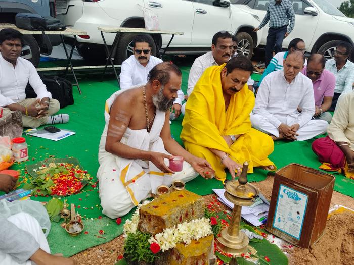 Lamp-lighting ritual at the Bhoomi Pooja